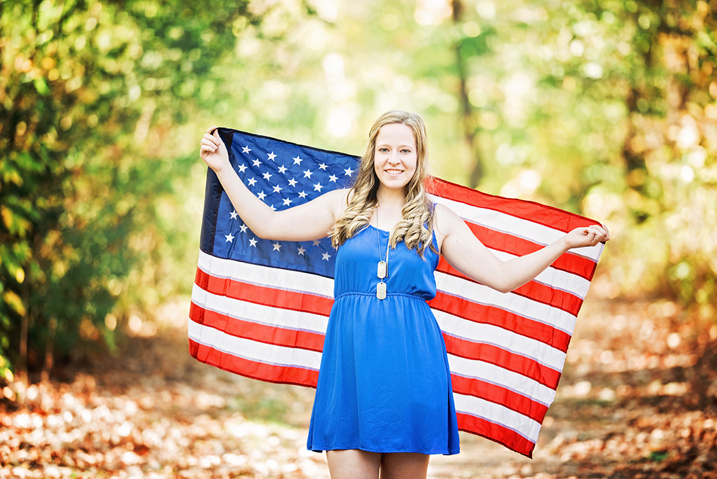 Michigan Senior Portraits - High School Senior with American Flag Behind Her