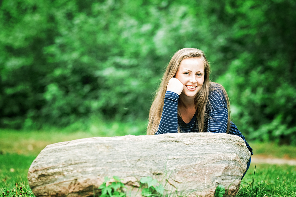 Michigan Senior Portraits - Senior Girl Leaning Against a Boulder