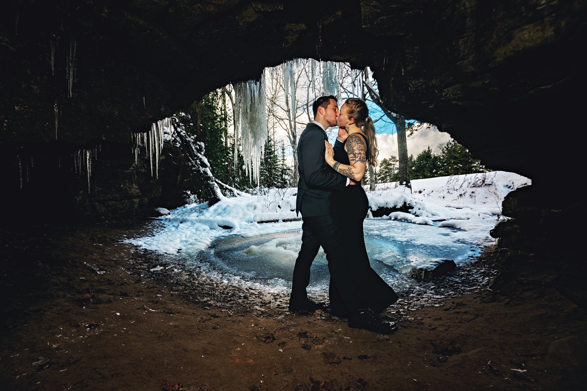 Have a true winter elopement adventure in the frozen caves of Northern Michigan