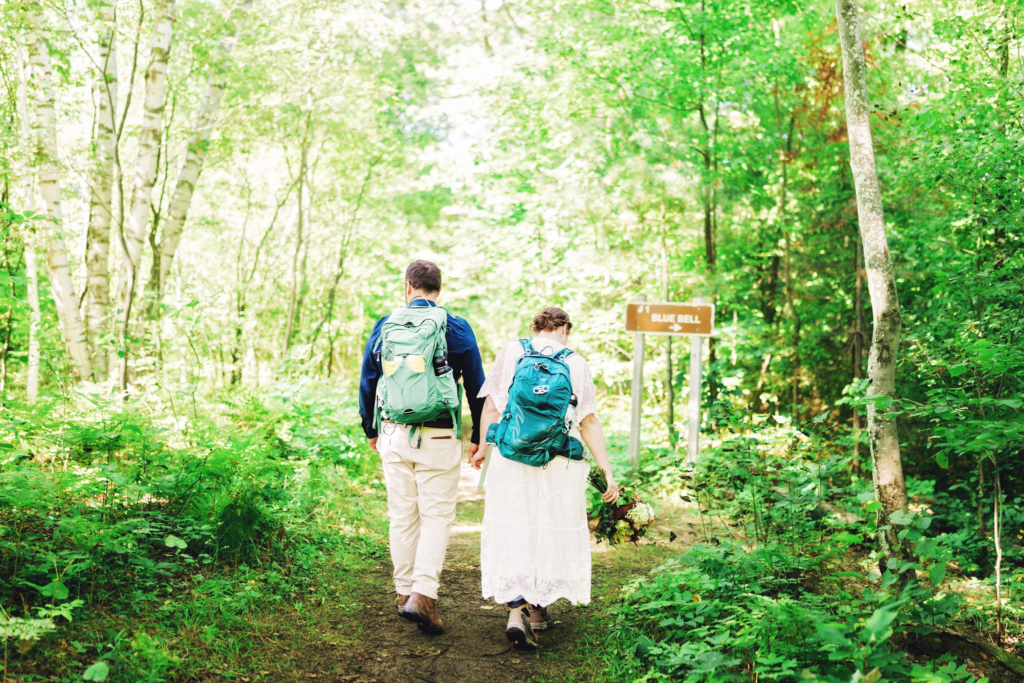 Hiking to the Negwegon State Park elopement ceremony location
